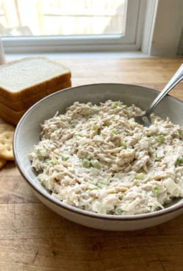 A close-up of finished Dixie Chick chicken salad served on a piece of bread.
